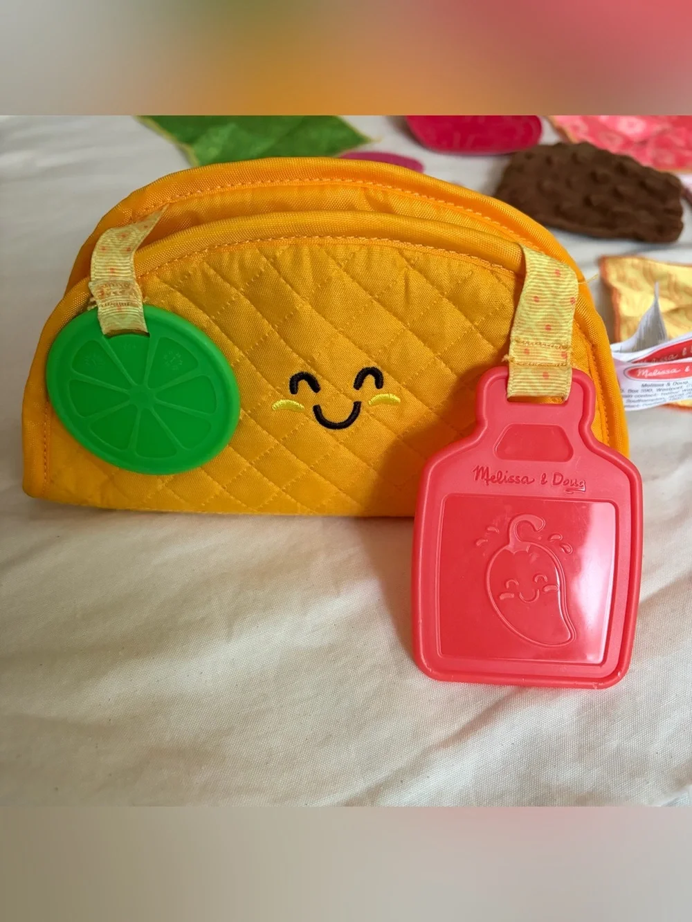 Melissa & Doug Multi-Sensory Soft Taco Fill and Spill Baby toy